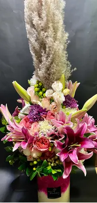 Exclusive arrangement in glass  vase. (flowers selected upon season and theme)