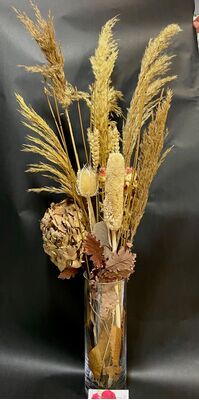 Dried Flowers Arrangement In Glass Vase. Autumn theme