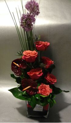 Flower arrangement in glass cube  vase