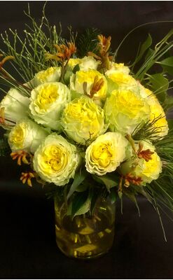 (21) yellow roses A' quality Dutch in basket with greens. Exclusive in vase.