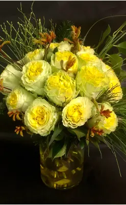 (21) yellow roses A' quality Dutch in basket with greens. Exclusive in vase.