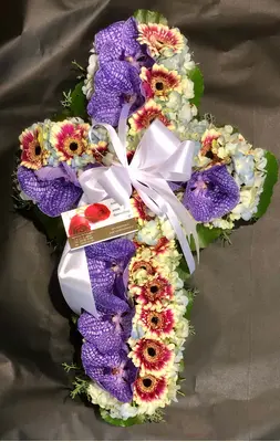 Funeral cross with orchids and roses