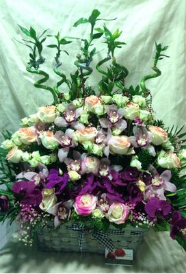 Arrangement in rectangular aluminum tray or basket.