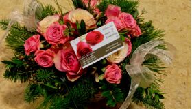 Flower arrangement pink colors in small basket with spring flavor