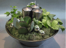 Plant arrangement with candles in metal pot