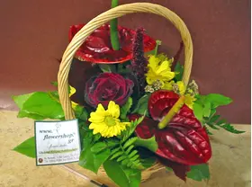 Flower arrangement in small  basket with autumn flavor