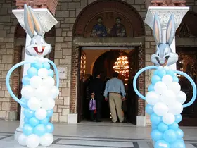 Baptismal ceremony. Human (cartoon) shape balloons.