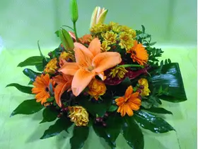 Metal pot with orange flowers