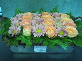 Basket arrangement with flowers in rows