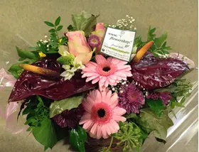Autumn basket with season flowers.