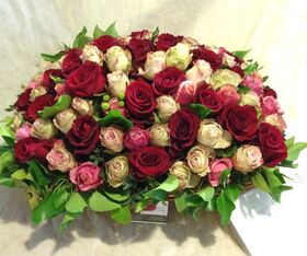 Pink & (or) Red Roses (100) stems round basket arrangement