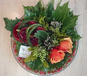 Flower arrangement in glass tray with autumn flavor