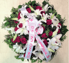White & red condolences wreath.