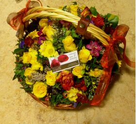 Spring colored flowers in basket.