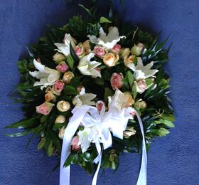 White or pink condolences wreath.