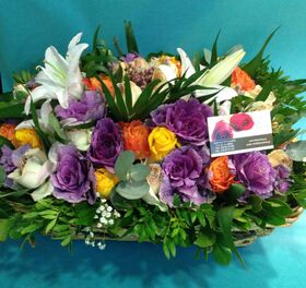 Big basket  with multi colored season flowers