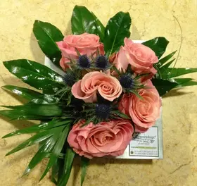 Arrangement with vanda orchids or roses in zink tray