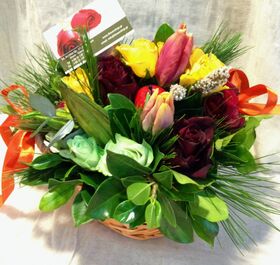Flower arrangement in small basket with autumn flavor
