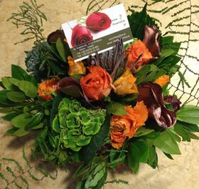Flower arrangement in small basket with autumn flavor.Salmon colors!
