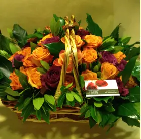 (41) orange - salmon  roses A' quality Dutch with greens in basket.