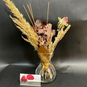 Dried Flowers Arrangement In Small Glass Vase. Autumn theme