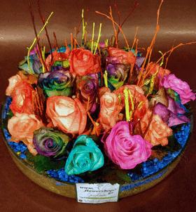 Arrangement in glass with "Rainbow" Roses"