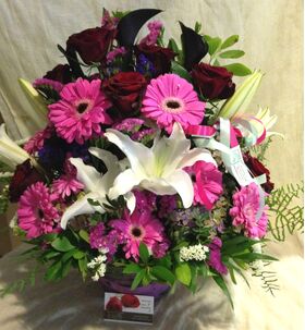 Arrangement In Glass Vase. Purple Flowers With Decorative Flower Gel. Exclusive.