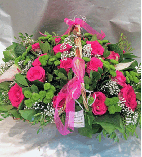 Big basket with flowers in green & pink shades.