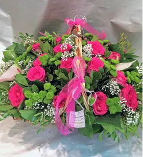 Big basket with flowers in green & pink shades.