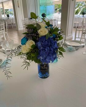 Wedding Flower Reception Decoration.Tables By the Pool or Sea.