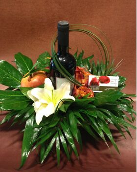 Flowers and wine in basket