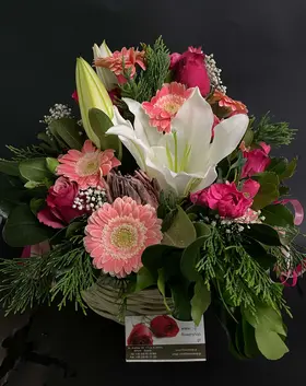 Autumn basket with season flowers.