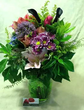 Spring flowers in glass vase. Exclusive.