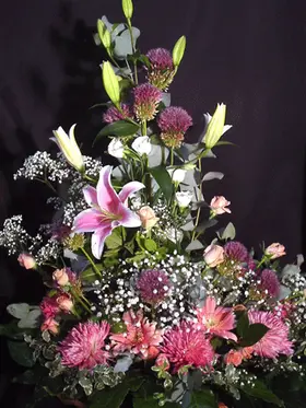 Arrangement in basket for new born girl