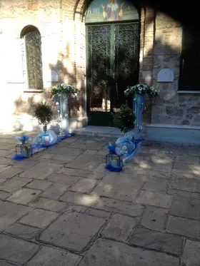 Arrow  shaped arrangements , Olive Plants (balls) and Candles
