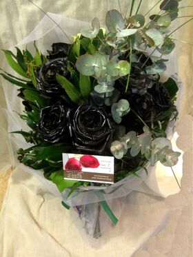 Roses black (9) stems arrangement in vase. Dyed.