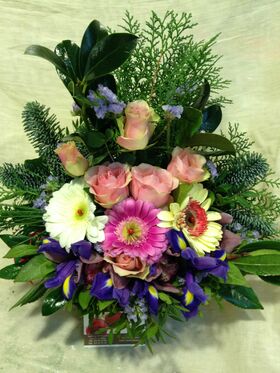 Small winter basket with  season flowers