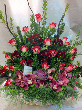 Basket with roses and cymbidium orchids