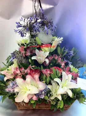 Basket arrangement  with pink season summer flowers