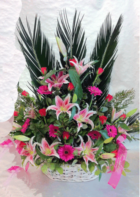 Pink flower arrangement in basket