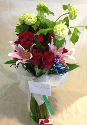 Flower bouquet with oriental lillies in glass vase with chipped colored oasis moss and gel!!!