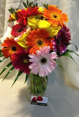Season flowers bouquet in glass vase with colored water !!!