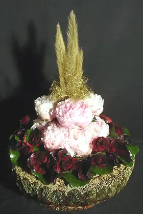 Basket with paeonias and roses