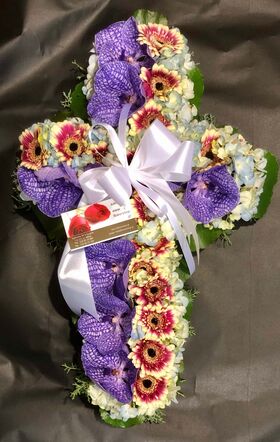 Funeral cross with orchids and roses