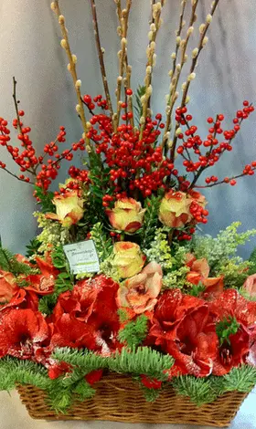 Ilex and pussy willow salix compined with season flowers in basket