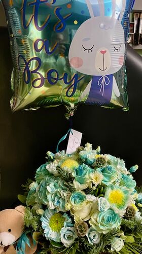 Arrangement of flowers for new born baby