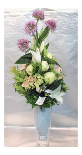 Flower bouquet with oriental lillies in glass vase