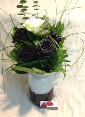 Roses black (9) stems arrangement in vase. Dyed.