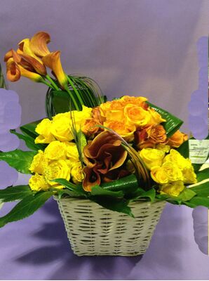 Exclusive Arrangement in basket. Level Grouped Roses