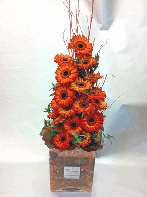 Gerbera "tower" in glass vase with decorative colored gel